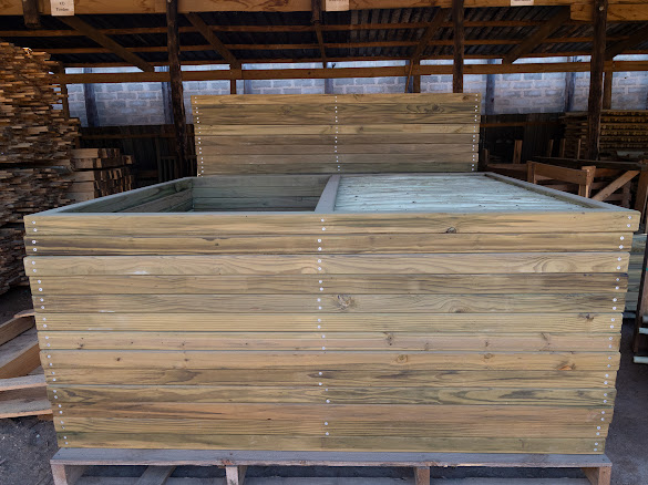 Stacked wooden planter boxes ready for the nursery trade