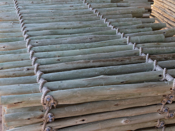 Bundles of Tanalith E treated timber curing at Timba Exports